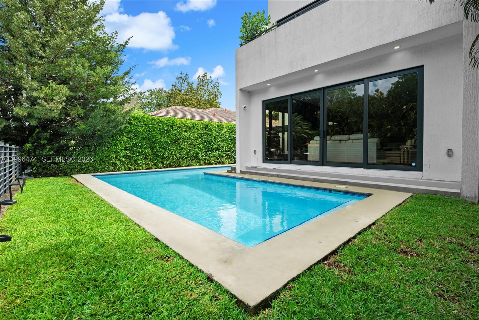 5735 Southwest 35th Street Miami, FL 33155 - Photo 30 of 30 a view of a house with pool and a yard