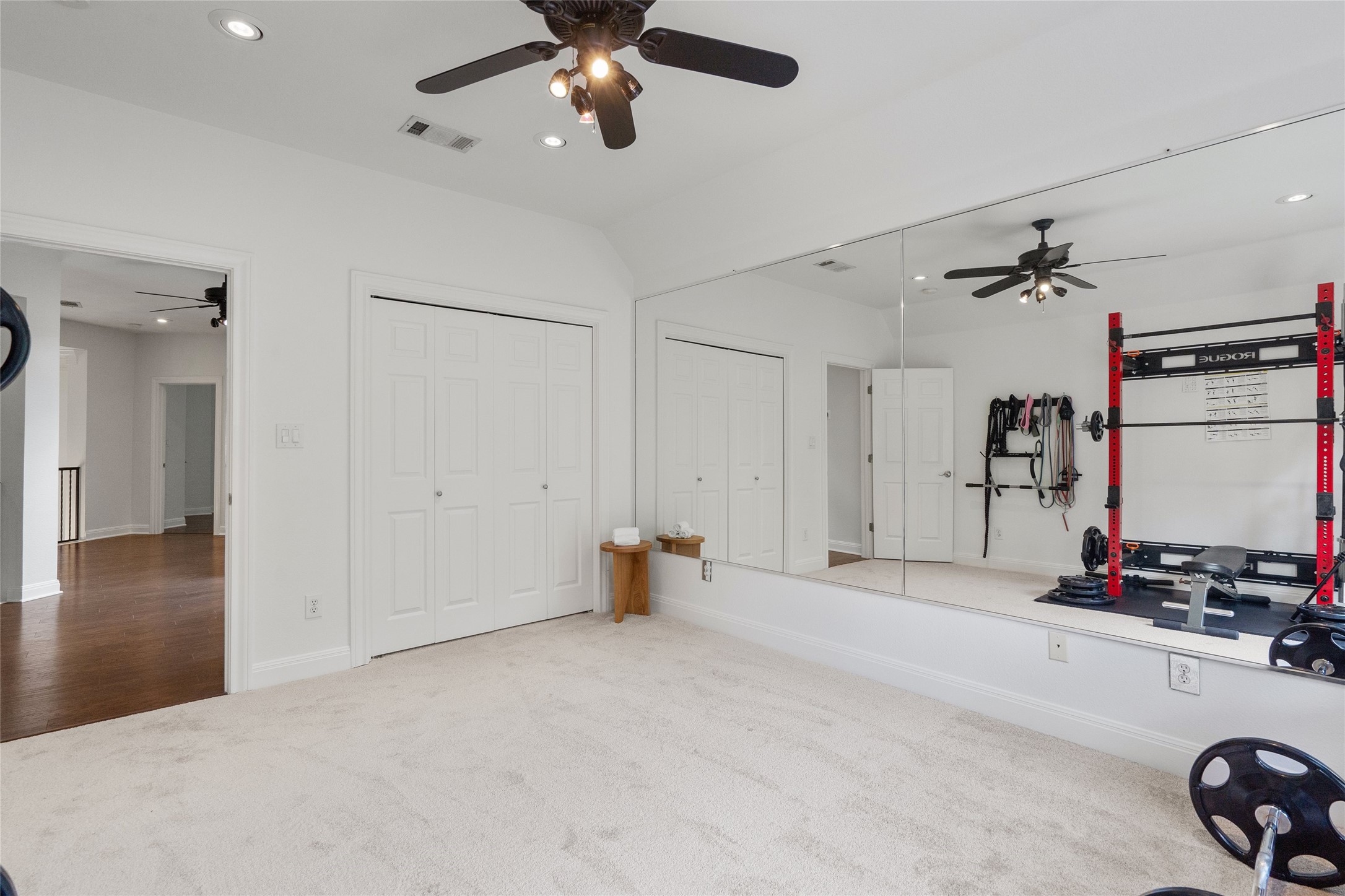 4313 Rio Robles Drive Austin, TX 78746 - Photo 28 of 40 An adaptable exercise room features ceiling fans, ample closet space, and a mirrored wall perfect for fitness activities.