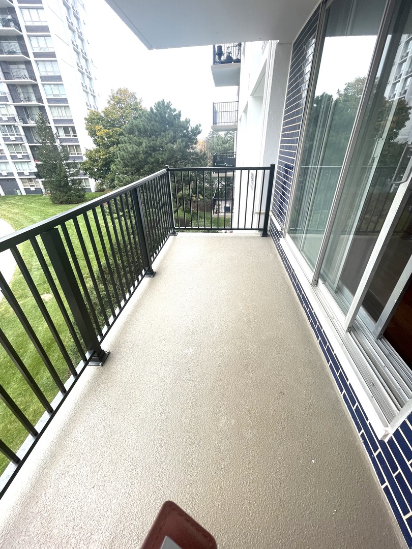 8801 West Golf Road, Unit 3H Niles, IL 60714 - Photo 15 of 33 a view of balcony with wooden floor