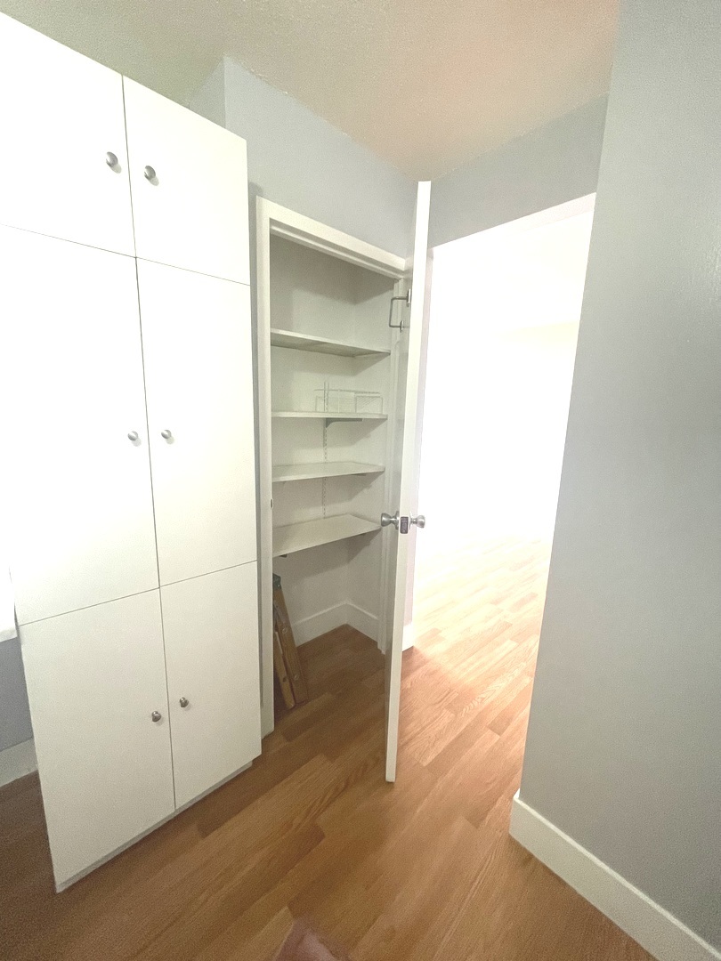 8801 West Golf Road, Unit 3H Niles, IL 60714 - Photo 20 of 33 a view of a room with wooden floor