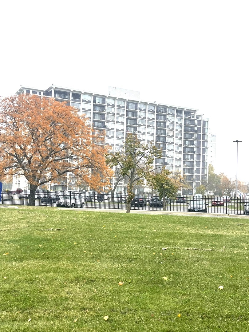 8801 West Golf Road, Unit 3H Niles, IL 60714 - Photo 2 of 33 a view of building with yard