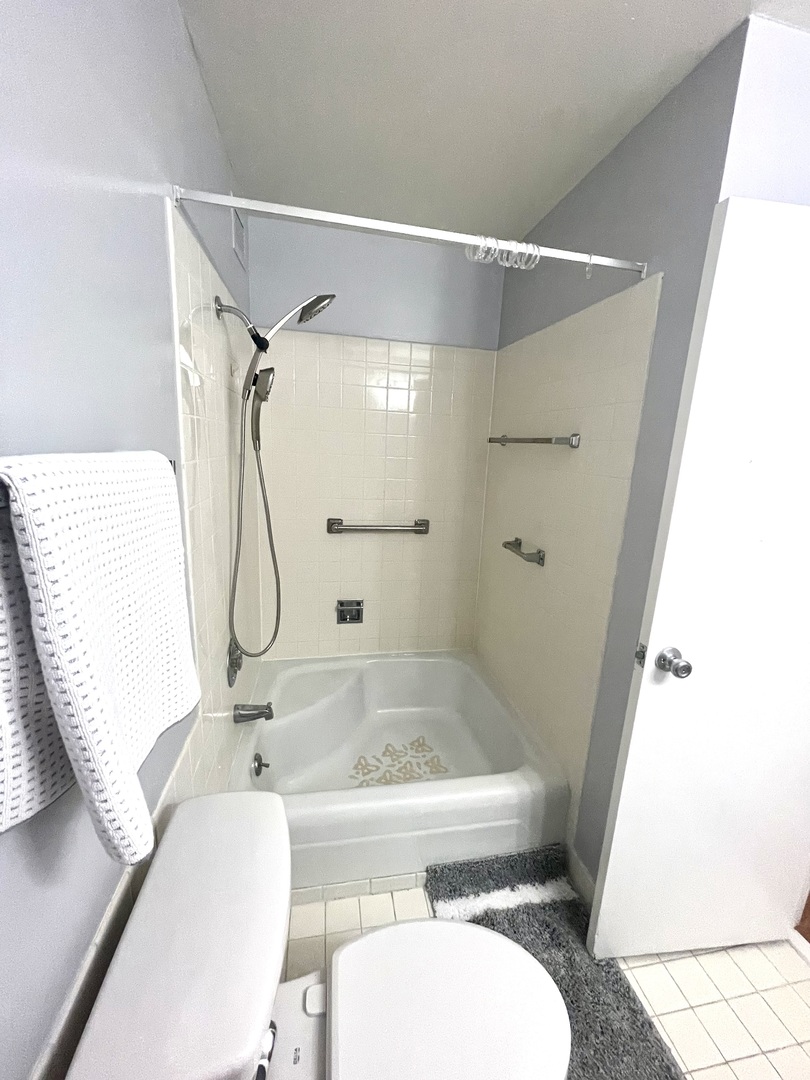 8801 West Golf Road, Unit 3H Niles, IL 60714 - Photo 24 of 33 a bathroom with a sink toilet and shower