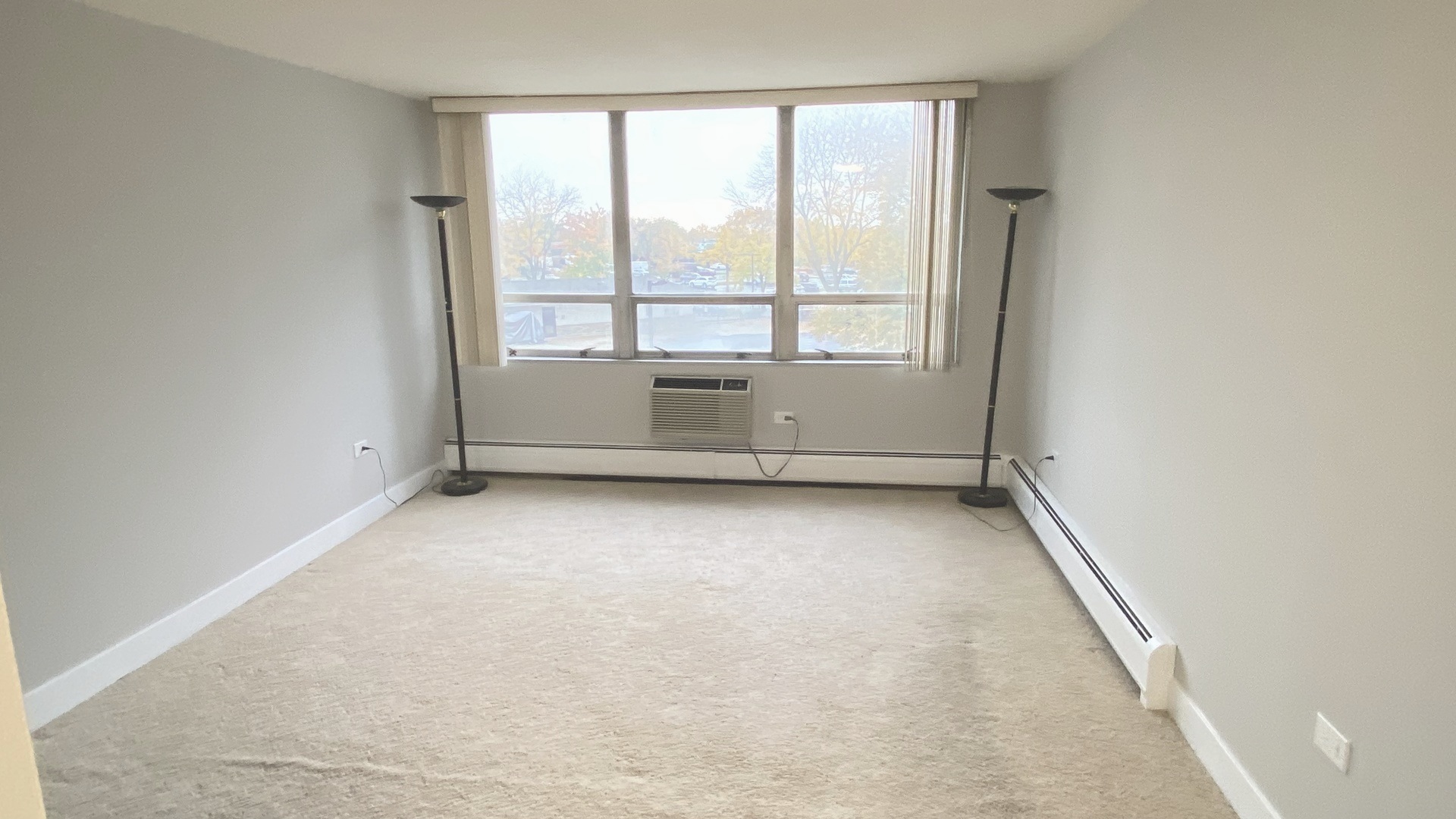 8801 West Golf Road, Unit 3H Niles, IL 60714 - Photo 26 of 33 an empty room with windows