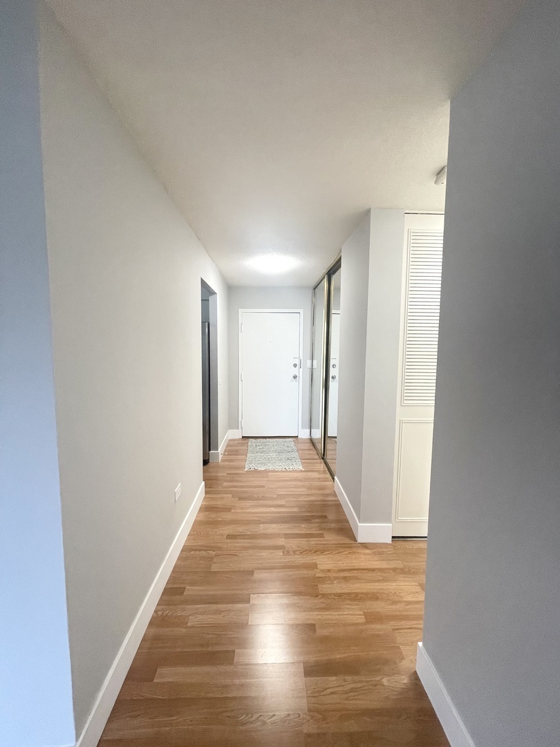 8801 West Golf Road, Unit 3H Niles, IL 60714 - Photo 28 of 33 a view of an empty room with wooden floor
