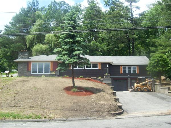 62 Palmer Road Monson, MA 01057 - Photo 1 of 17 a front view of a house with a garden