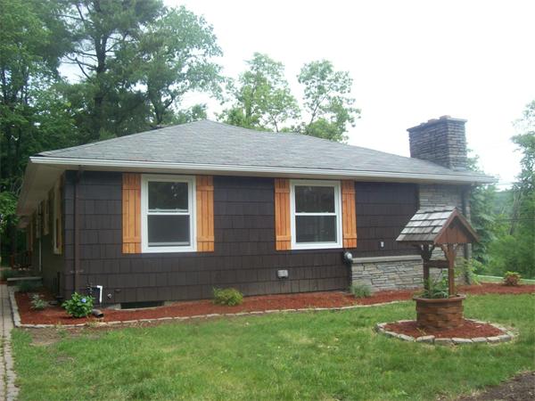 62 Palmer Road Monson, MA 01057 - Photo 2 of 17 a front view of house with yard and green space