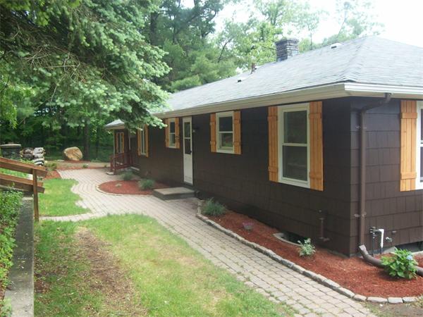 62 Palmer Road Monson, MA 01057 - Photo 3 of 17 a backyard of a house with seating space