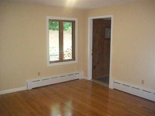 62 Palmer Road Monson, MA 01057 - Photo 10 of 17 an empty room with wooden floor and windows