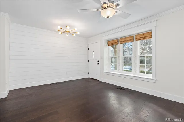 a view of an entryway with wooden floor