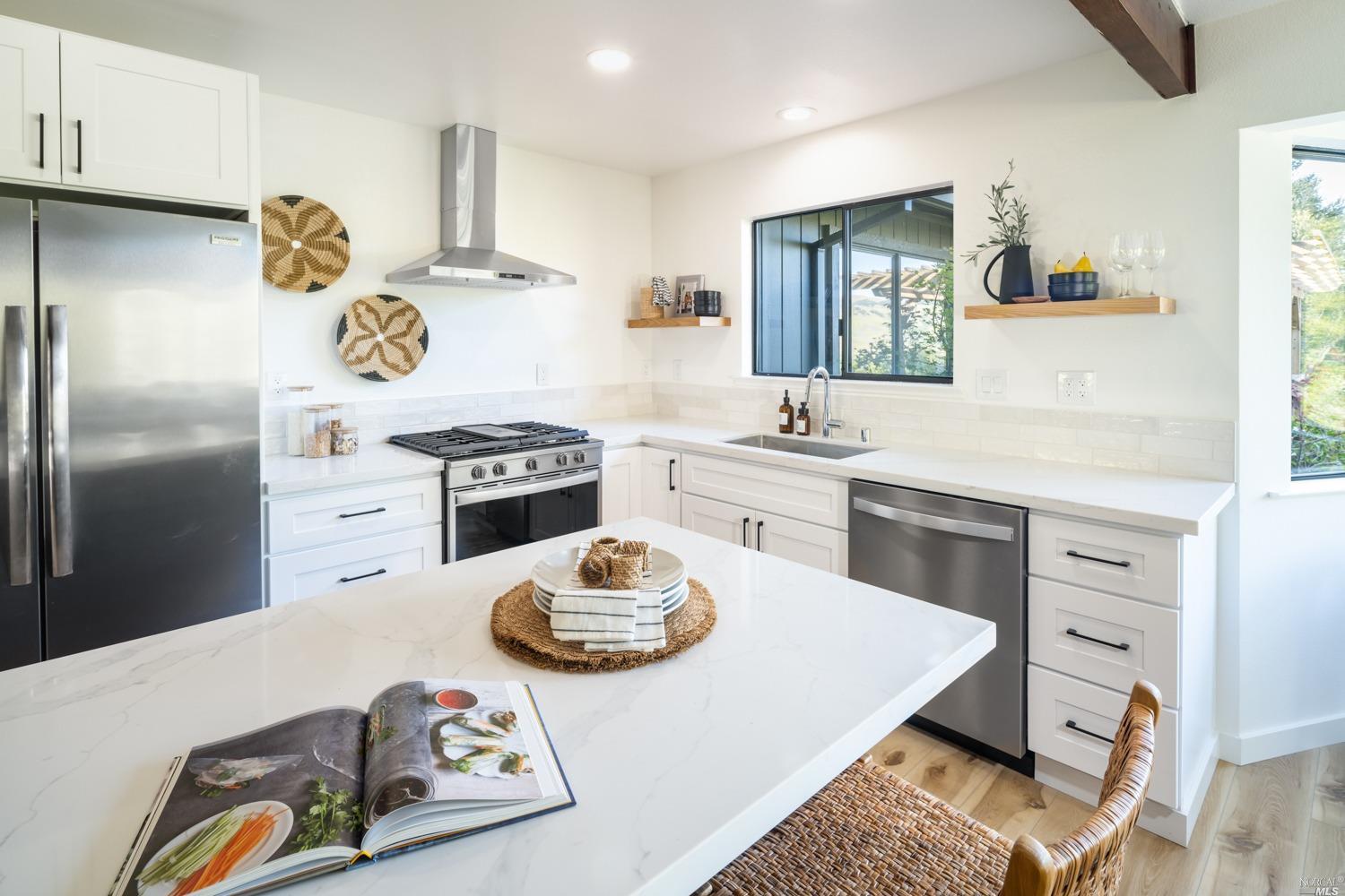 5757 Lucas Valley Road Nicasio, CA 94946 - Photo 12 of 60 a kitchen with a refrigerator a stove a sink and a refrigerator