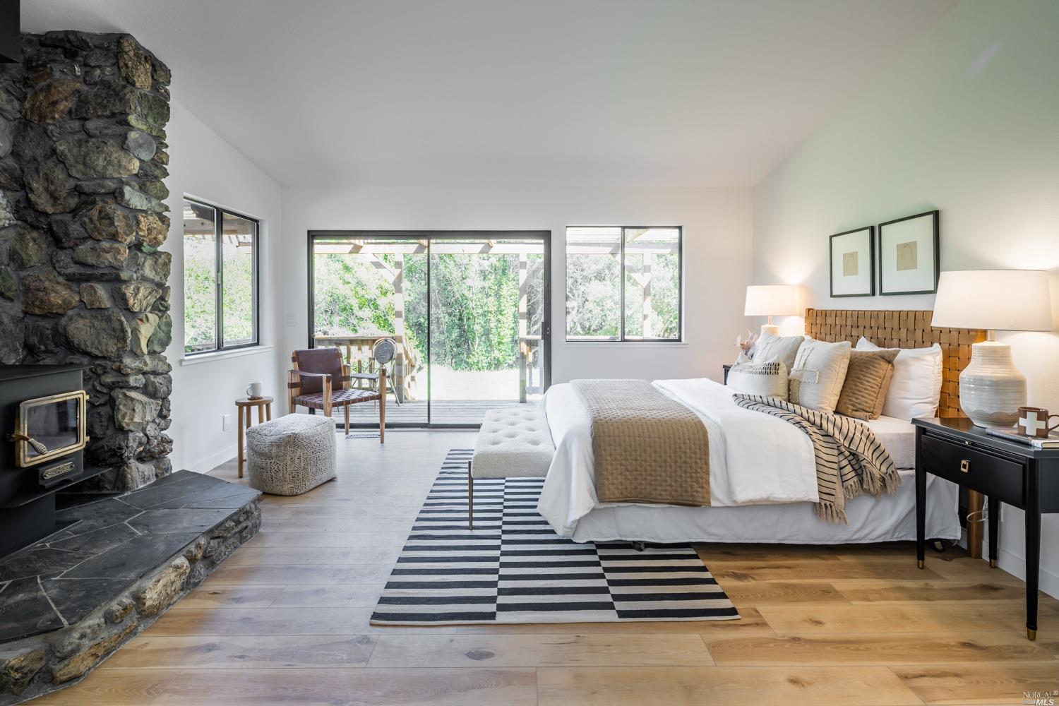 5757 Lucas Valley Road Nicasio, CA 94946 - Photo 15 of 60 a bedroom with furniture and a large window