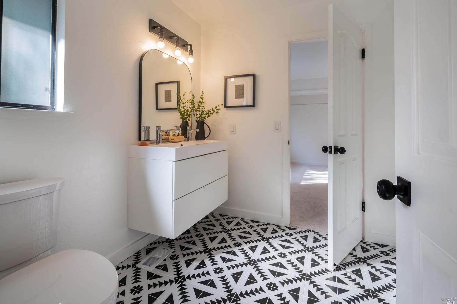 5757 Lucas Valley Road Nicasio, CA 94946 - Photo 21 of 60 a bathroom with a sink toilet and shower
