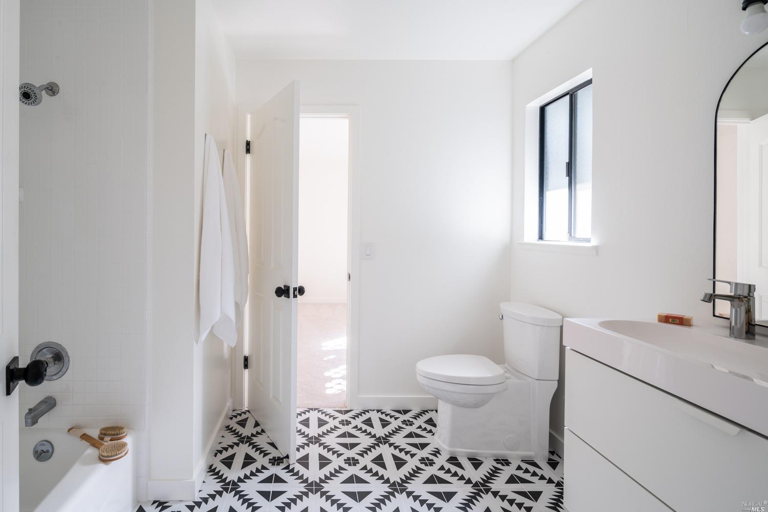 5757 Lucas Valley Road Nicasio, CA 94946 - Photo 22 of 60 a bathroom with a sink toilet and shower