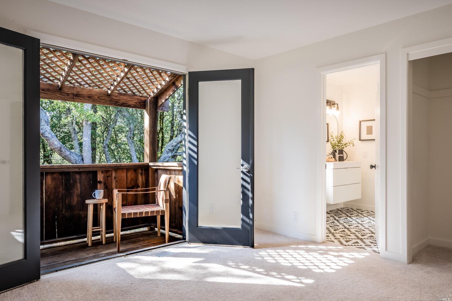 5757 Lucas Valley Road Nicasio, CA 94946 - Photo 25 of 60 a view of an empty room with wooden floor and a window