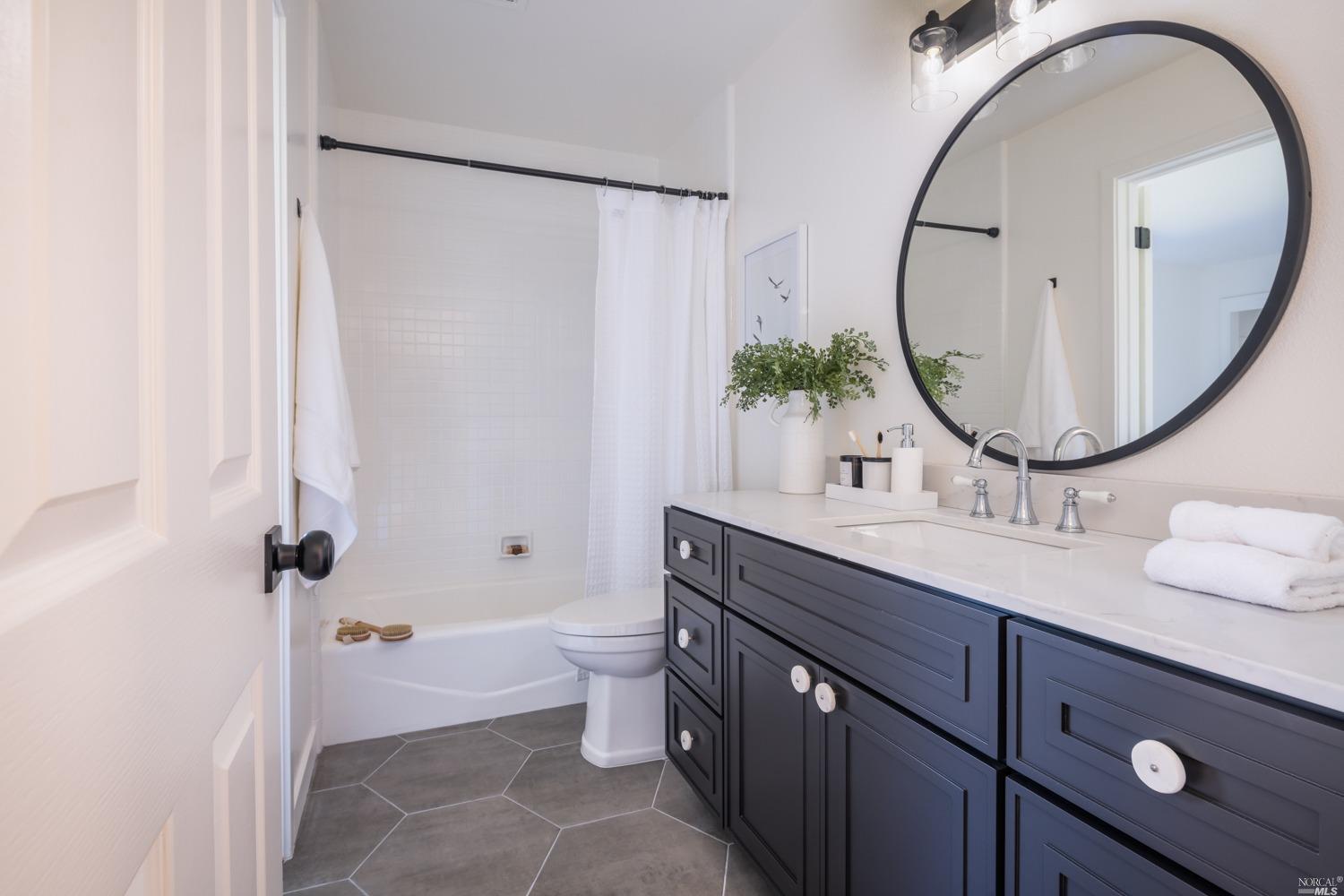 5757 Lucas Valley Road Nicasio, CA 94946 - Photo 27 of 60 a bathroom with a sink a toilet and a mirror
