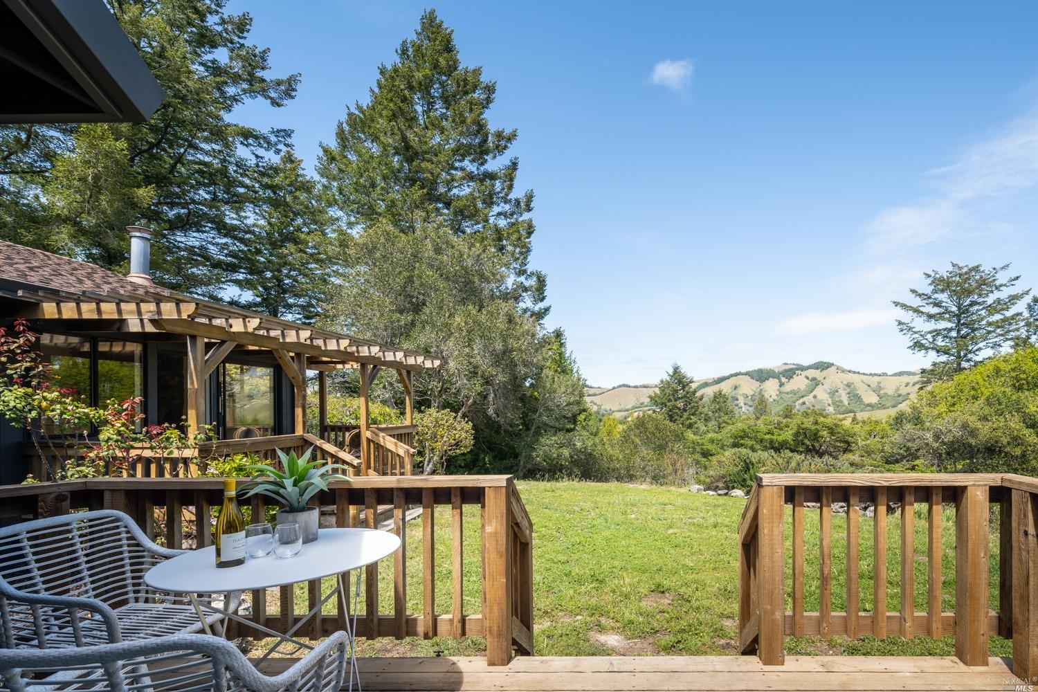 5757 Lucas Valley Road Nicasio, CA 94946 - Photo 31 of 60 a view of a patio with couches table and chairs and potted plants