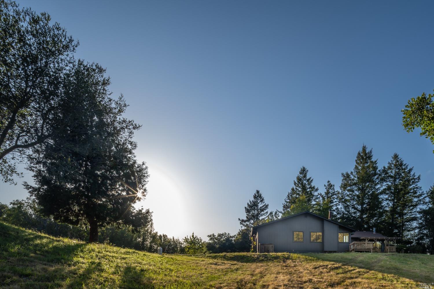 5757 Lucas Valley Road Nicasio, CA 94946 - Photo 32 of 60 a view of a house with a yard