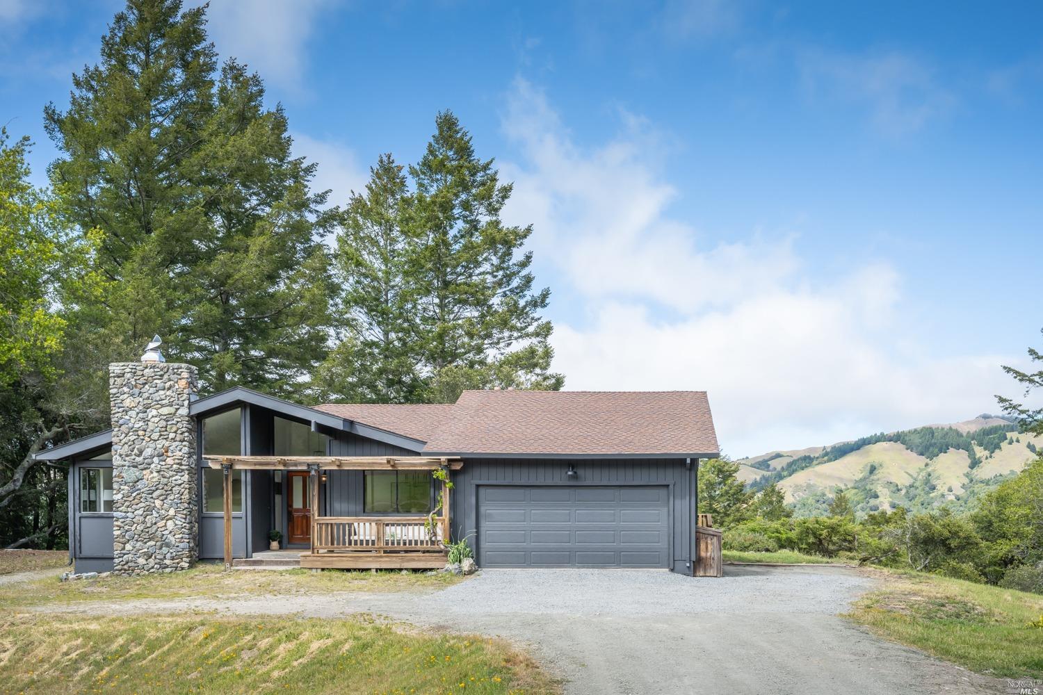 5757 Lucas Valley Road Nicasio, CA 94946 - Photo 33 of 60 a front view of a house with a garden