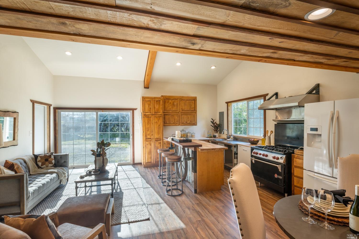 5757 Lucas Valley Road Nicasio, CA 94946 - Photo 40 of 60 a living room with fireplace furniture and a dining table
