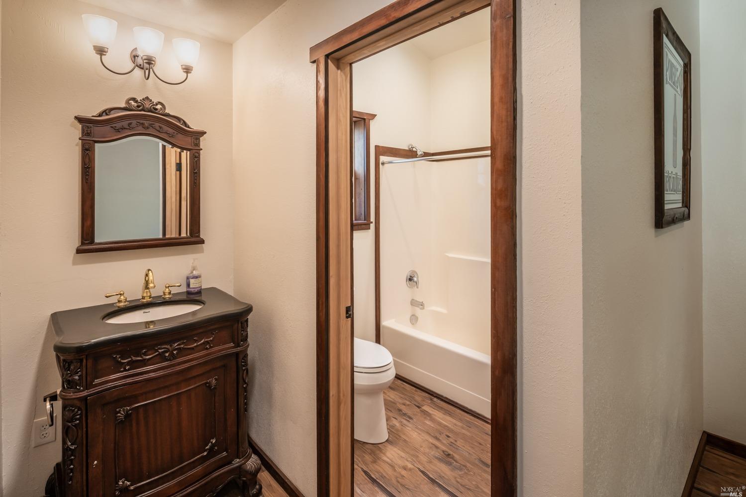5757 Lucas Valley Road Nicasio, CA 94946 - Photo 42 of 60 a bathroom with a sink a toilet and a mirror