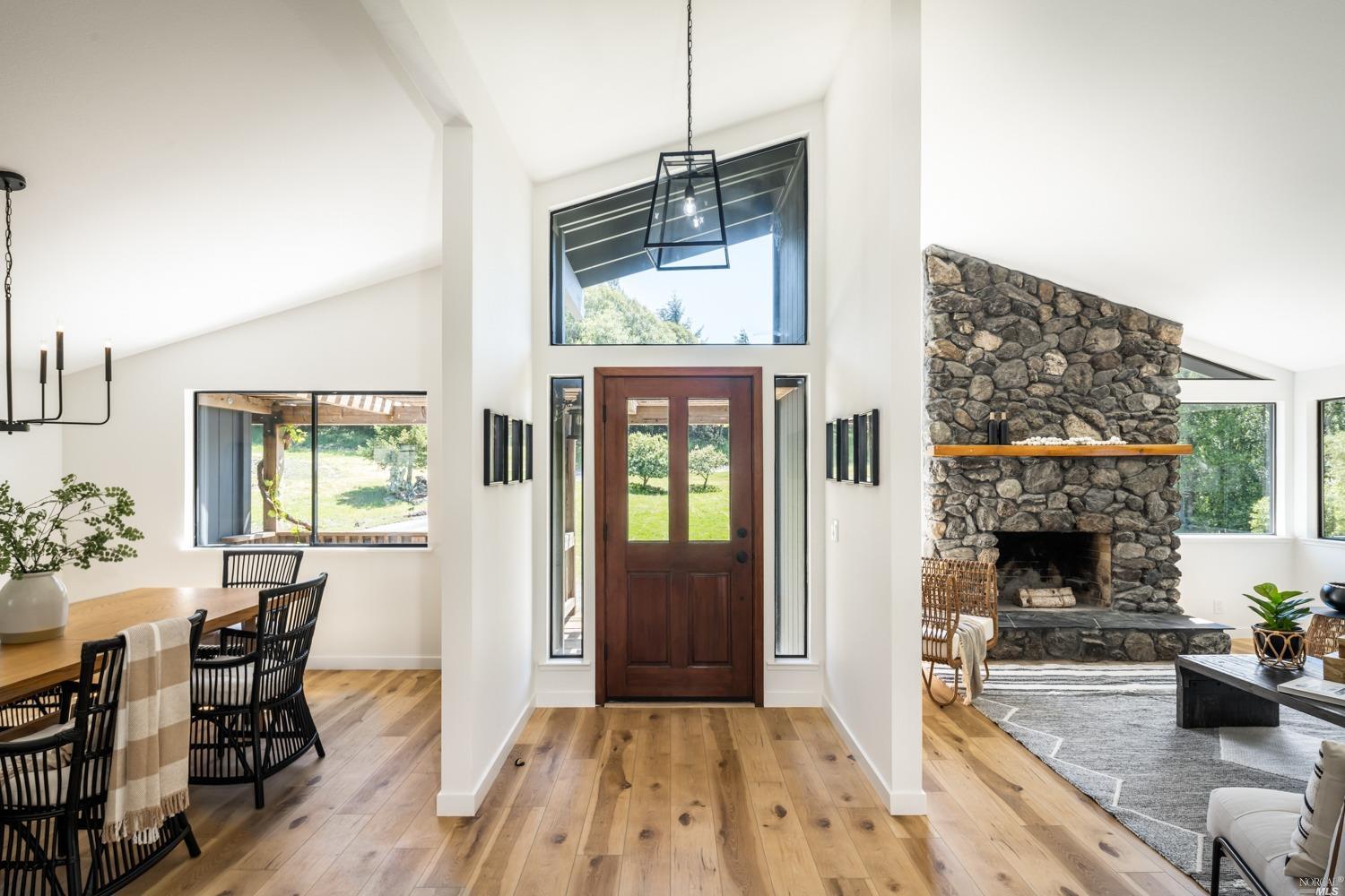 5757 Lucas Valley Road Nicasio, CA 94946 - Photo 5 of 60 a living room with furniture and a fireplace