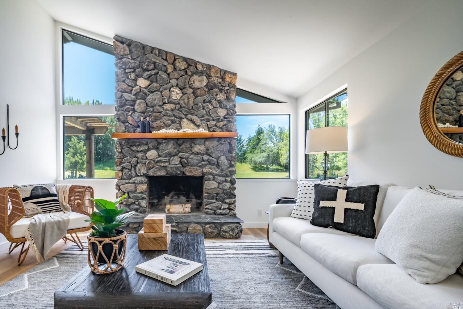 5757 Lucas Valley Road Nicasio, CA 94946 - Photo 9 of 60 a living room with furniture and a fireplace