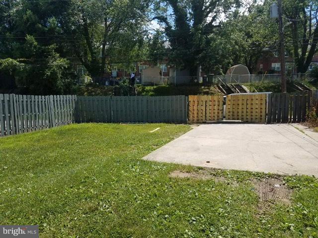 1623 Ramblewood Road Baltimore, MD 21239 - Photo 24 of 24 Fence being painted