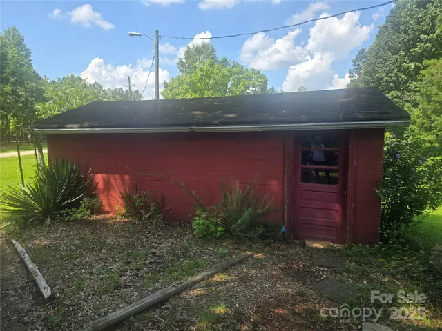 a couple of potted plants in front of a door