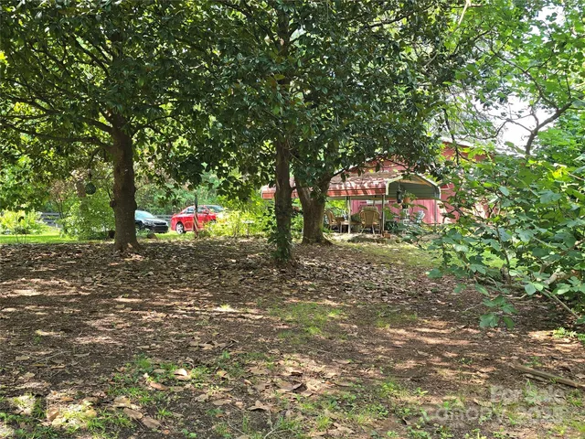 a view of outdoor space with playground and green space