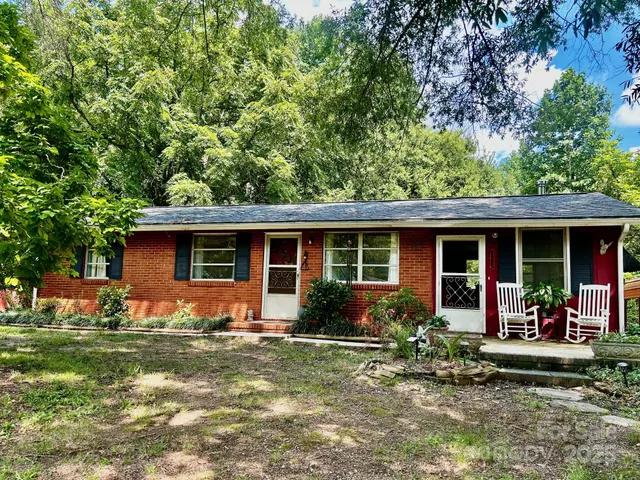 a front view of house with yard and seating space