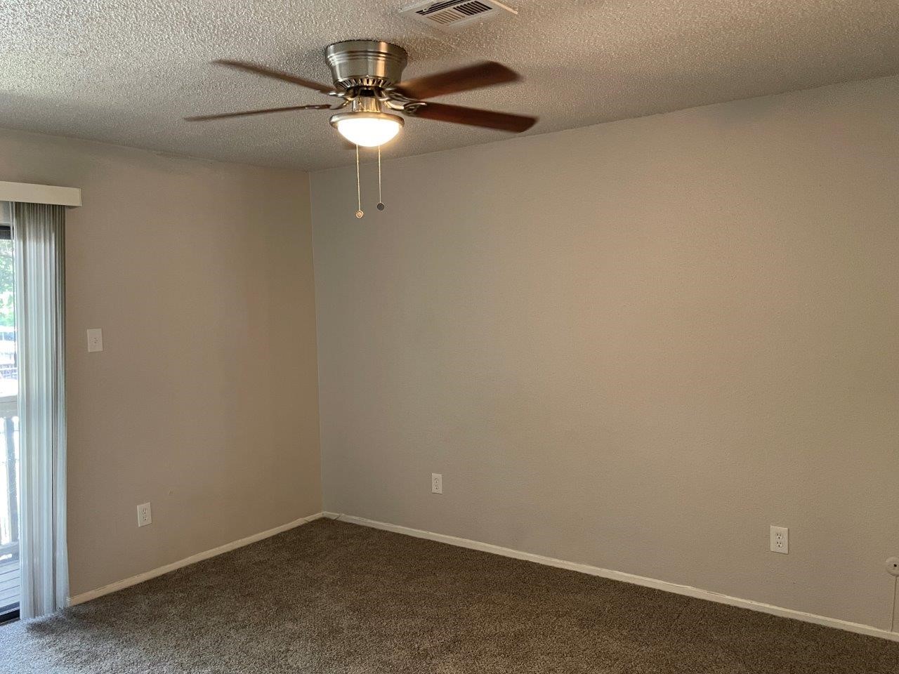 3608 Ocee Street Houston, TX 77063 - Photo 29 of 31 an empty room with a chandelier fan and a table