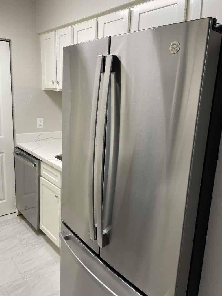3608 Ocee Street Houston, TX 77063 - Photo 9 of 31 a view of a refrigerator and microwave in a kitchen