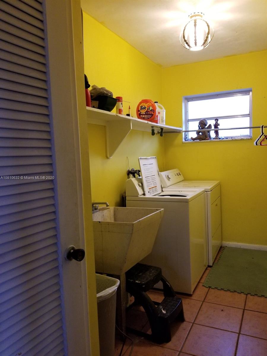 2001 North Park Road Hollywood, FL 33021 - Photo 29 of 49 laundry room with washer, dryer, laundry tub/sink, closet.