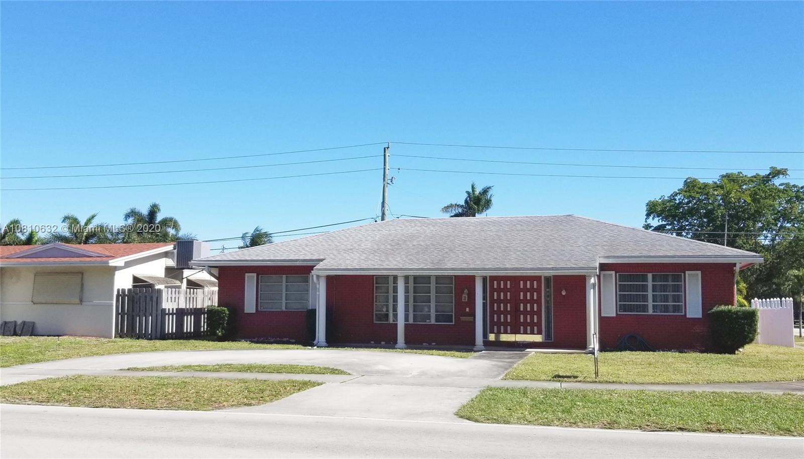 2001 North Park Road Hollywood, FL 33021 - Photo 7 of 49 front of house, faces west, circular driveway, front porch, dimensional fiberglass shingle roof