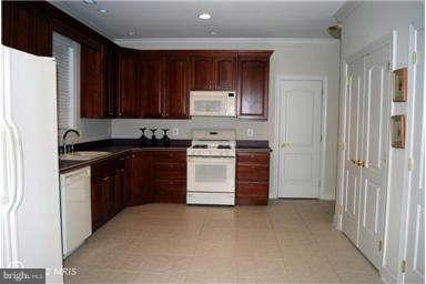 2925 Marlow Road Silver Spring, MD 20904 - Photo 17 of 20 a kitchen with a stove sink and a refrigerator