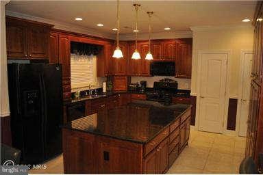 2925 Marlow Road Silver Spring, MD 20904 - Photo 6 of 20 a kitchen with a sink and a refrigerator