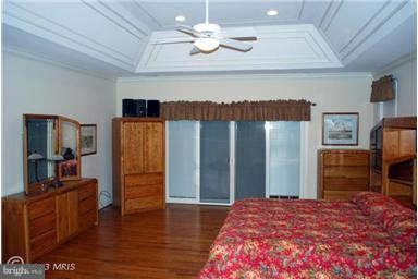 2925 Marlow Road Silver Spring, MD 20904 - Photo 9 of 20 a bedroom with a bed and wooden floor