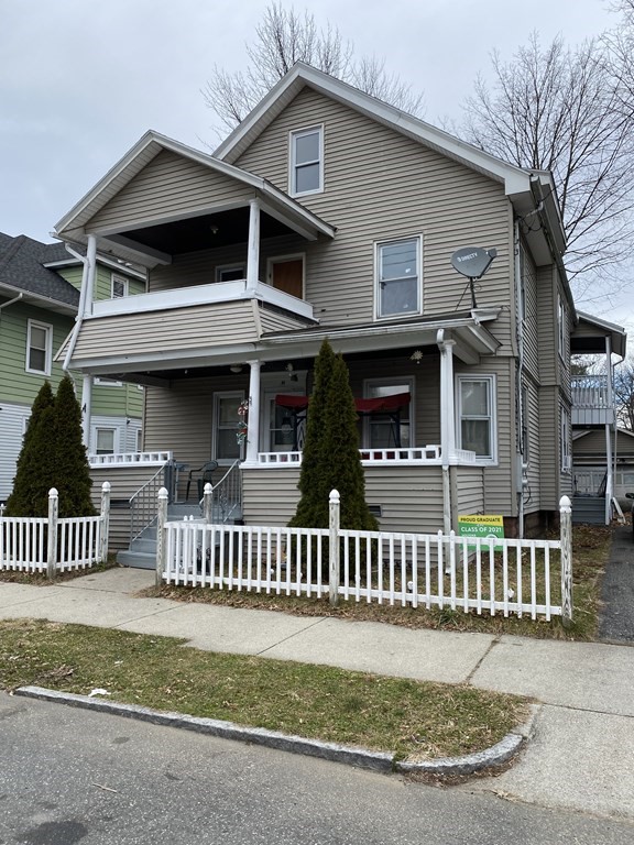 41-43 Lester Street Springfield, MA 01108 - Photo 2 of 25 a front view of a house with a garden