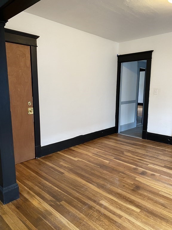 41-43 Lester Street Springfield, MA 01108 - Photo 21 of 25 a view of empty room with wooden floor
