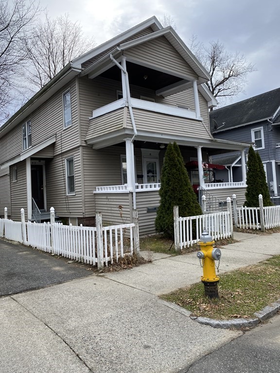 41-43 Lester Street Springfield, MA 01108 - Photo 3 of 25 a front view of a house with a porch