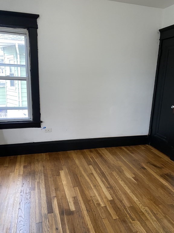 41-43 Lester Street Springfield, MA 01108 - Photo 8 of 25 a view of a room with wooden floor and a window