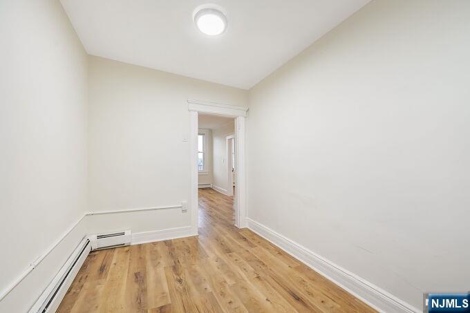 743 Harrison Avenue Harrison, NJ 07029 - Photo 15 of 50 a view of room with window and wooden floor