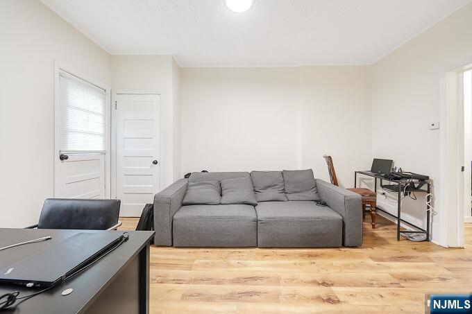 743 Harrison Avenue Harrison, NJ 07029 - Photo 23 of 50 a living room with furniture and a table