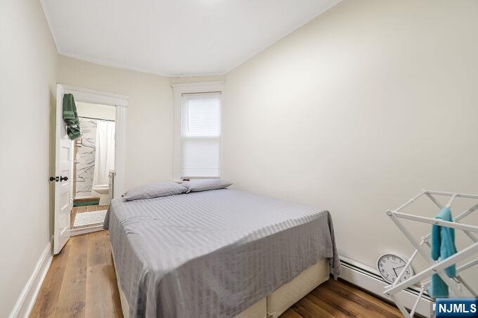 743 Harrison Avenue Harrison, NJ 07029 - Photo 27 of 50 a bedroom with a bed and a window