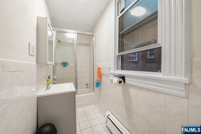743 Harrison Avenue Harrison, NJ 07029 - Photo 30 of 50 a bathroom with a sink and a mirror