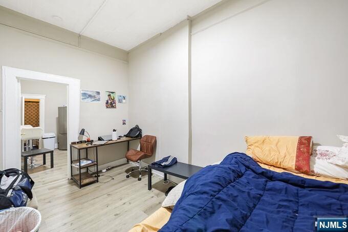 743 Harrison Avenue Harrison, NJ 07029 - Photo 40 of 50 a living room with furniture and wooden floor
