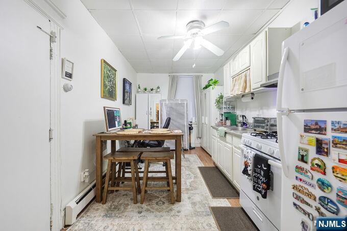743 Harrison Avenue Harrison, NJ 07029 - Photo 44 of 50 a kitchen with stainless steel appliances kitchen island granite countertop furniture and a refrigerator