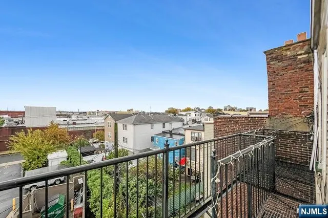 a view of a balcony with city view