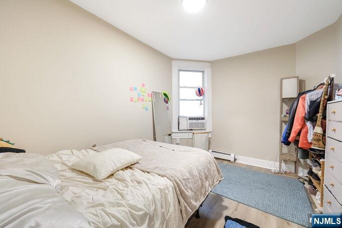 743 Harrison Avenue Harrison, NJ 07029 - Photo 10 of 50 a bedroom with a bed and a window