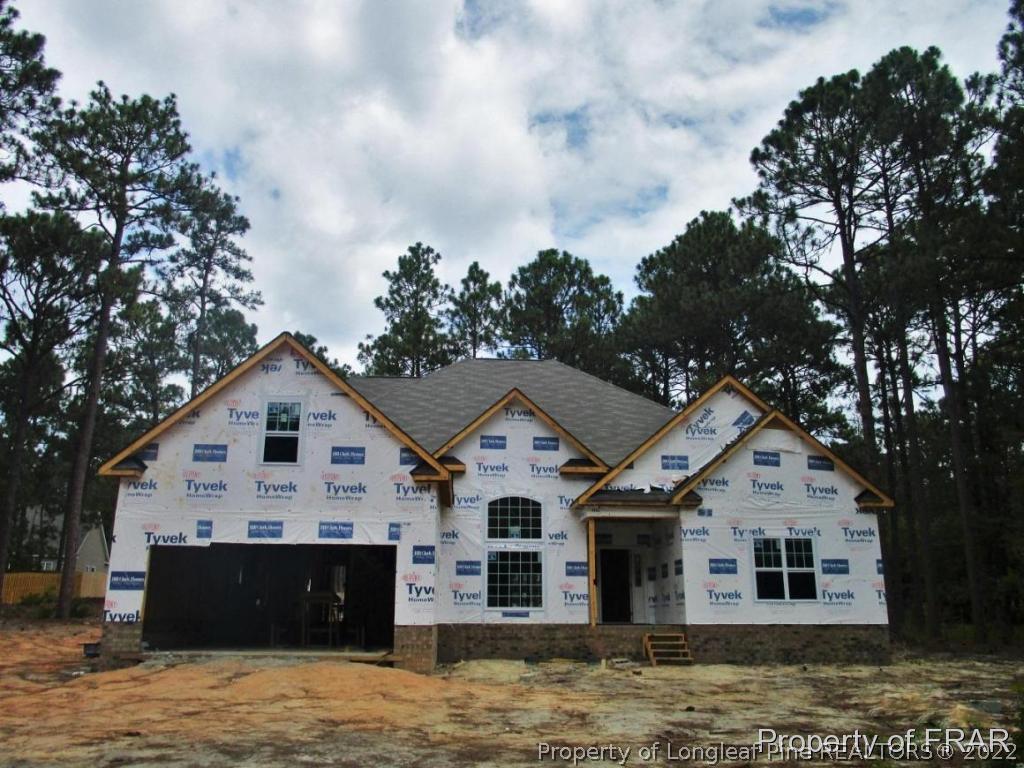 604 Longleaf Road Aberdeen, NC 28315 - Photo 1 of 8 a view of a house with a yard